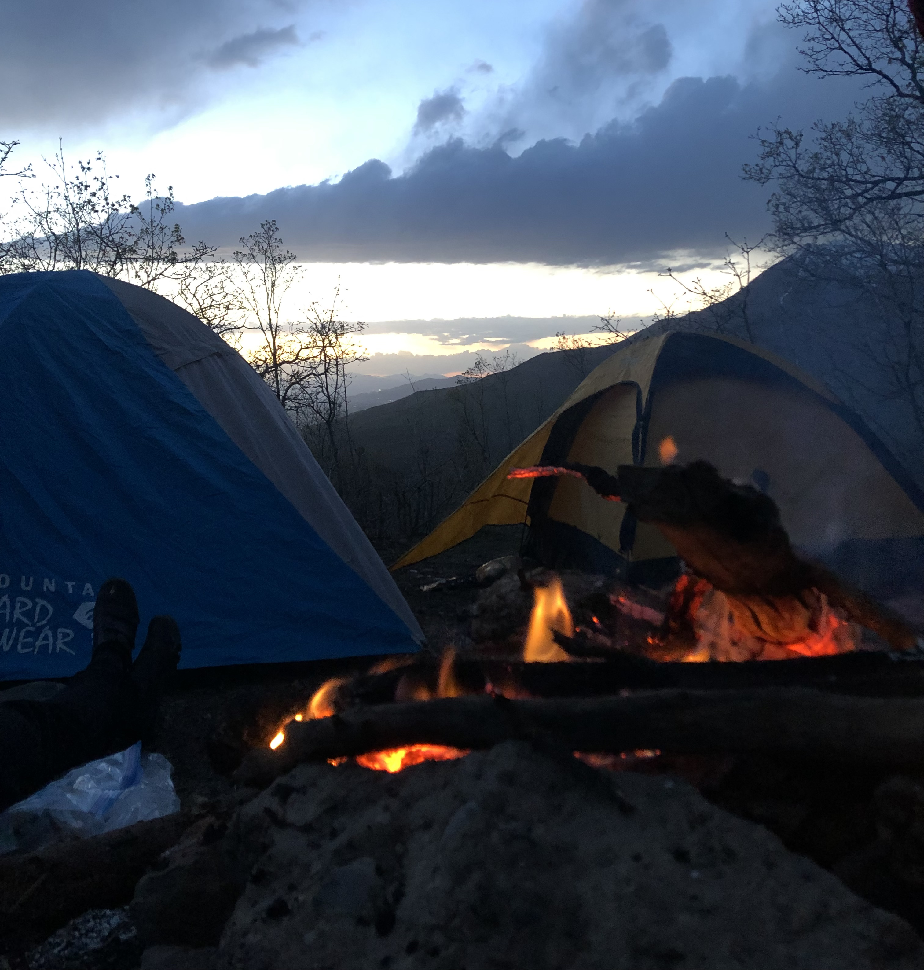 Nothing special, just a photo by the fire. Something about sitting by a fire makes you think about life a little more. I love the layers of mountains in the distance visible from the sun going down.